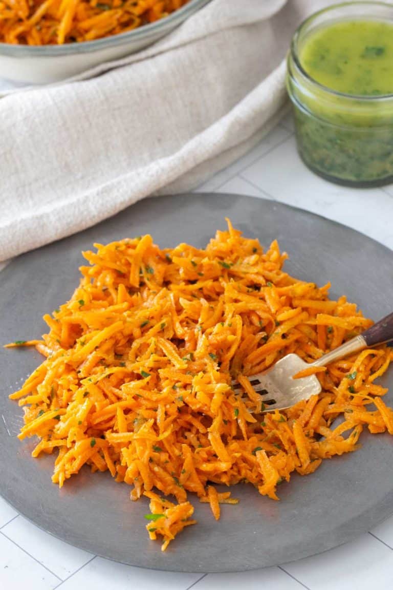 carrot salad on metal plate with fork