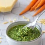 bowl of carrot top pesto with spoon