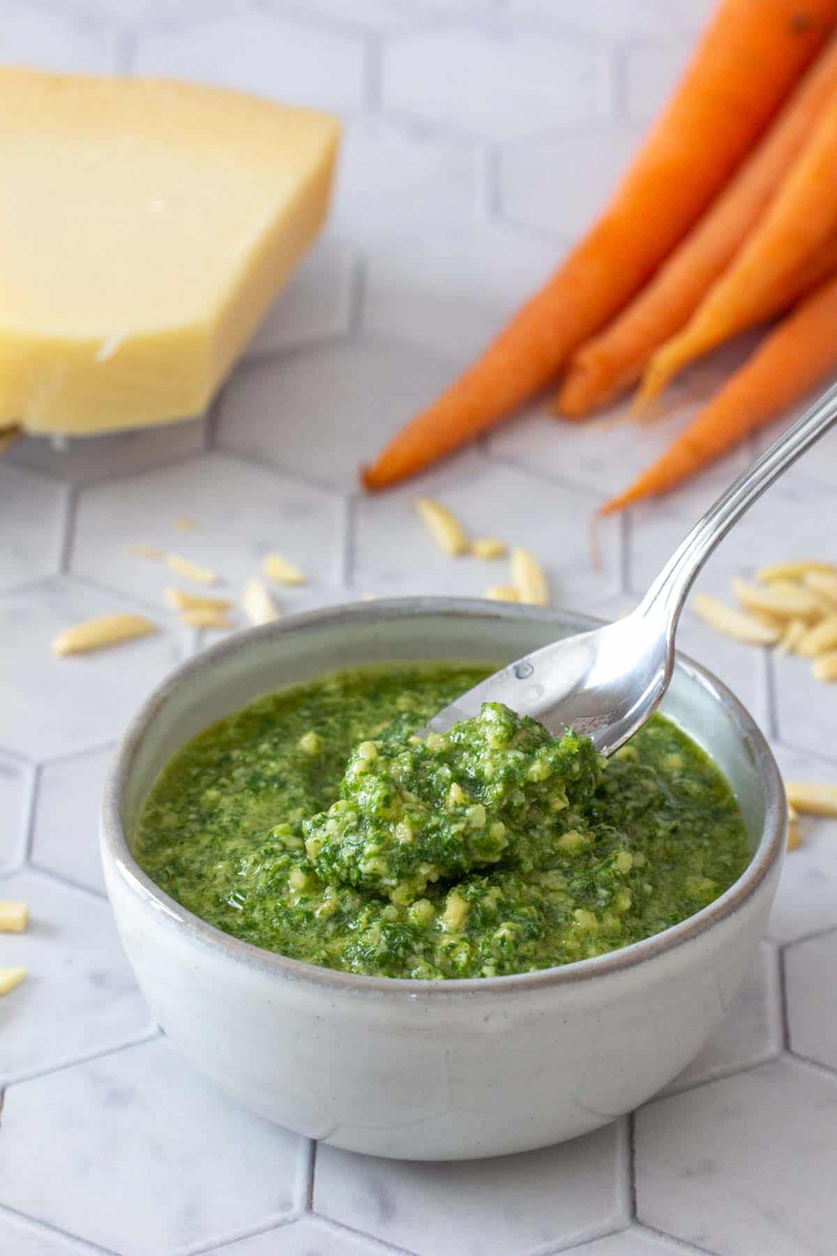 bowl of carrot top pesto with spoon