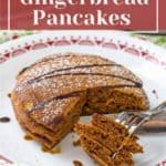 Gingerbread cornbread pancakes on a plate with a fork.