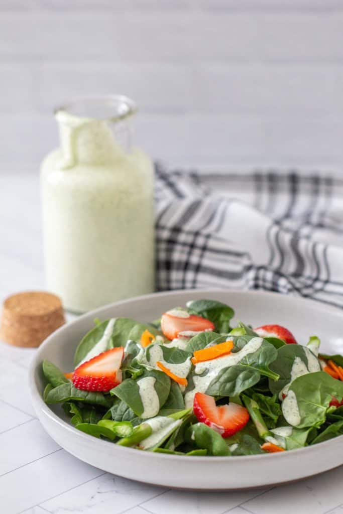 green goddess dressing drizzled on salad