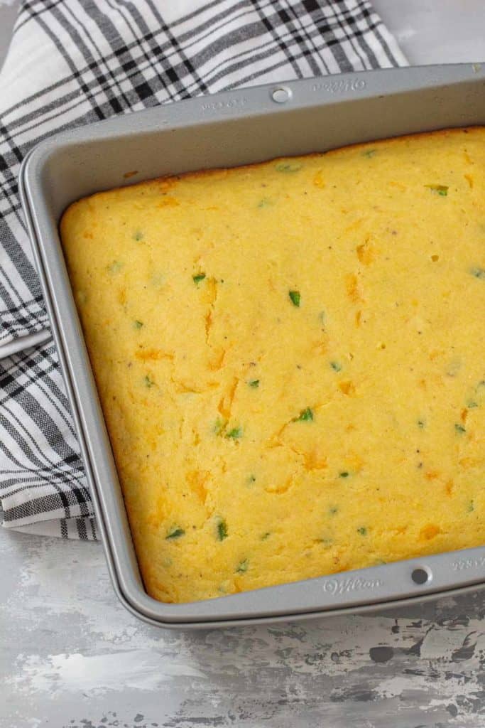 jalapeno cheddar cornbread in a baking pan