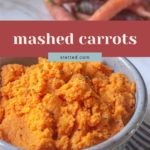 A bowl of mashed carrots seasoned with pepper sits on a striped cloth, highlighting the creamy texture of mashed carrots, with whole carrots in the background.