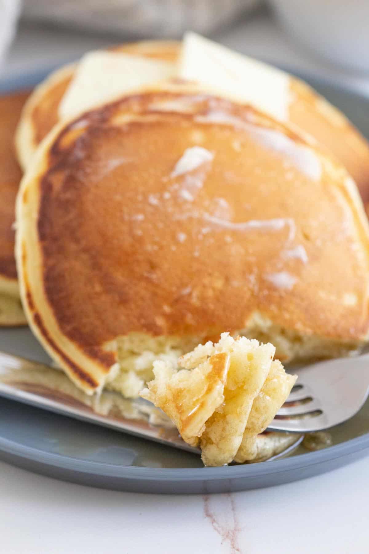fork with pieces of buttermilk pancakes