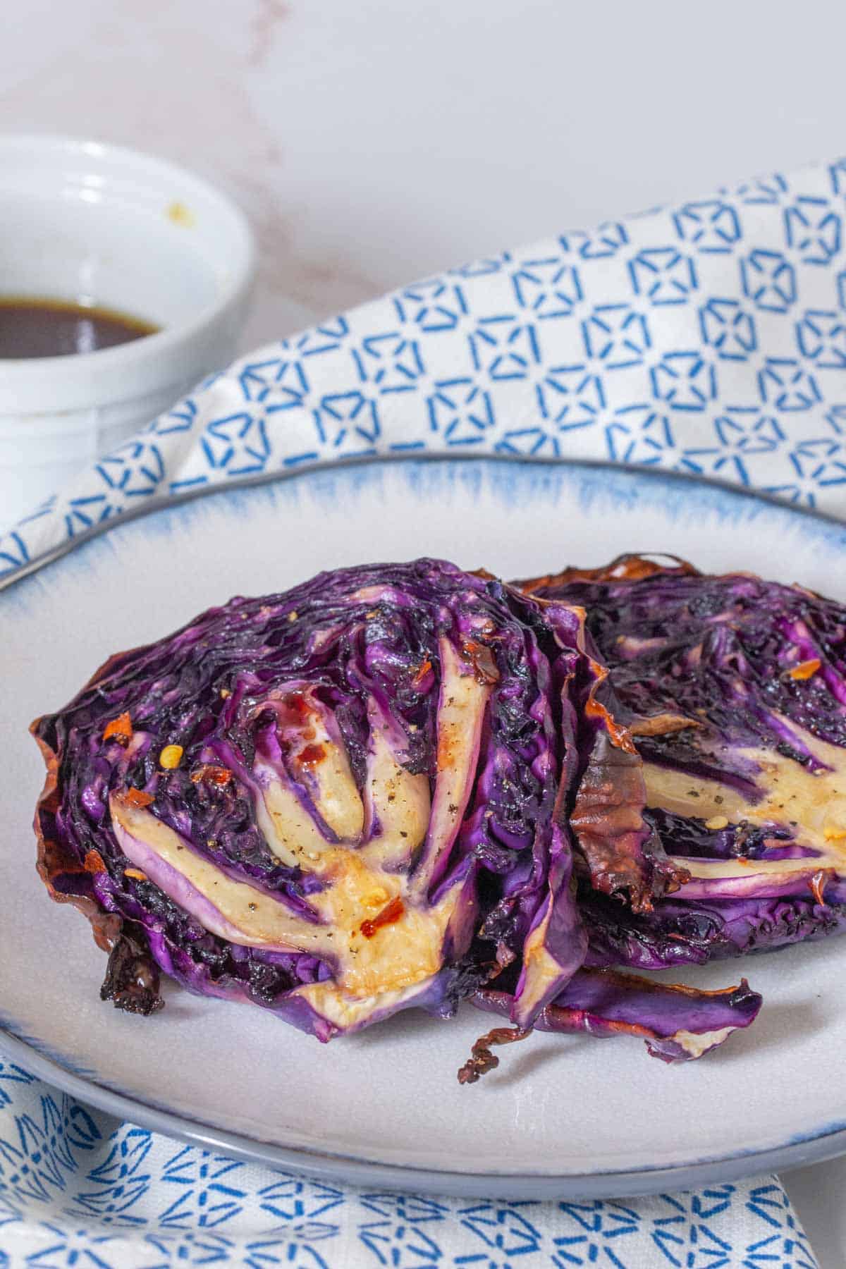 close up of cabbage steaks on plate