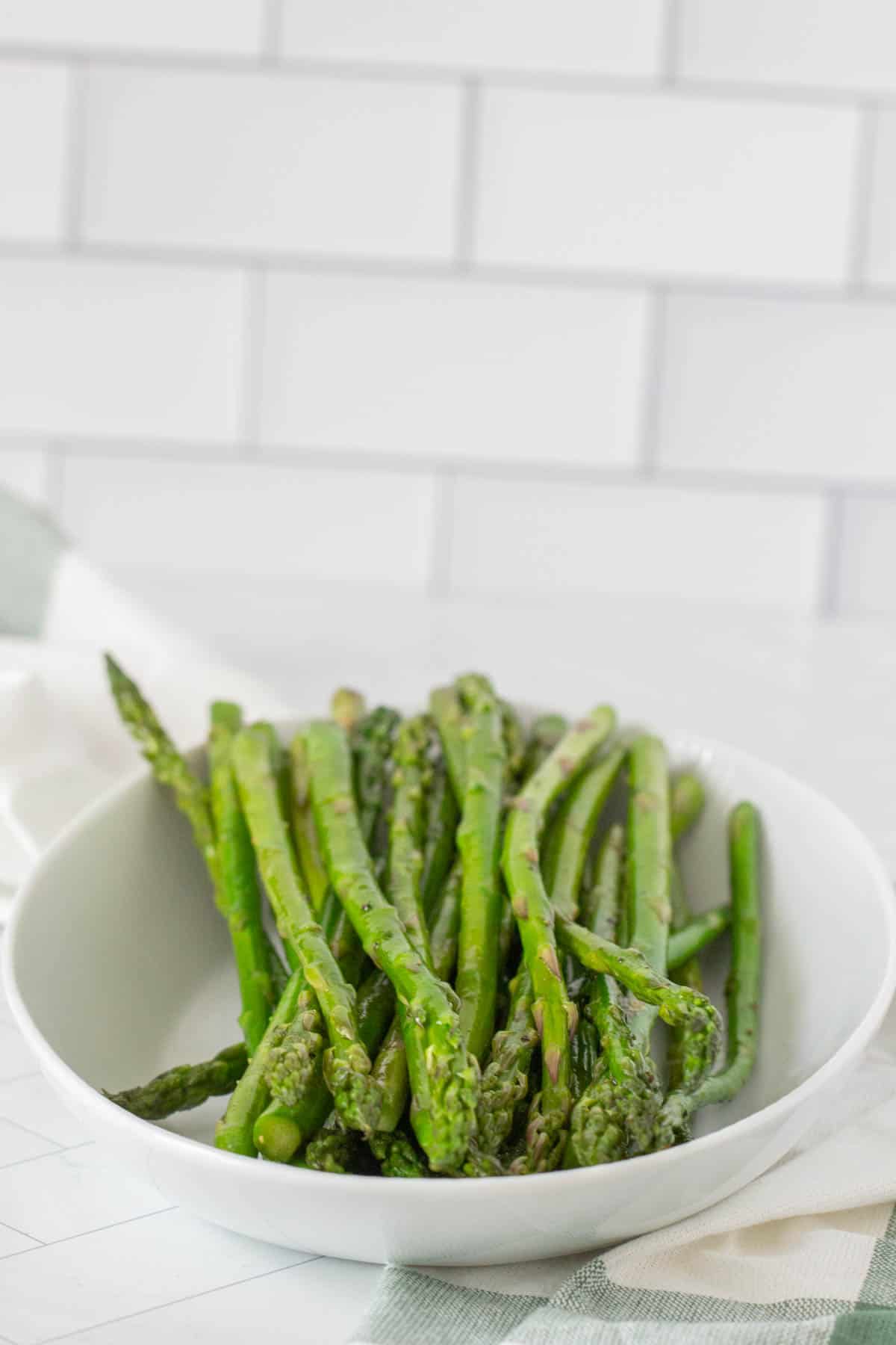 sauteed asparagus in serving bowl