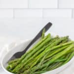 white dish with sauteed asparagus