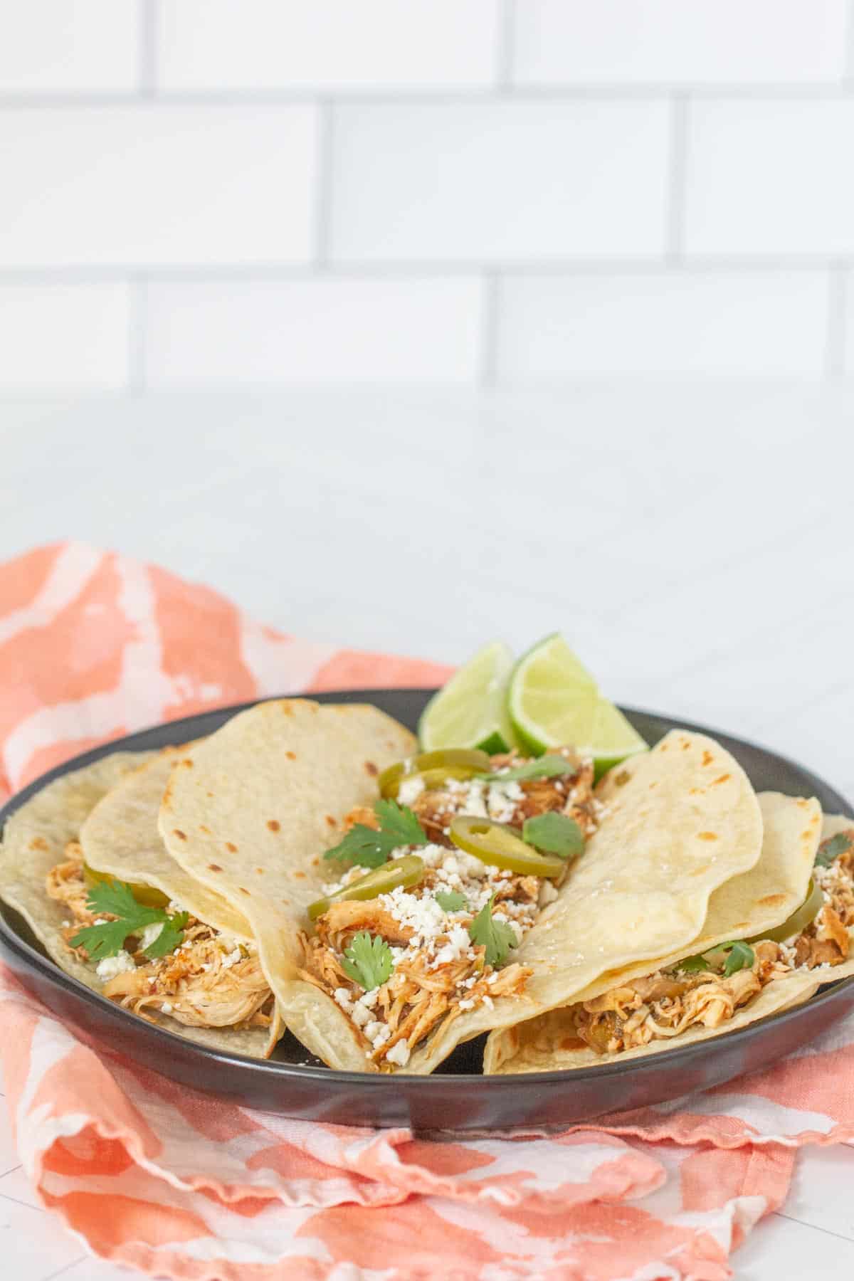 plate of slow cooker chicken tacos