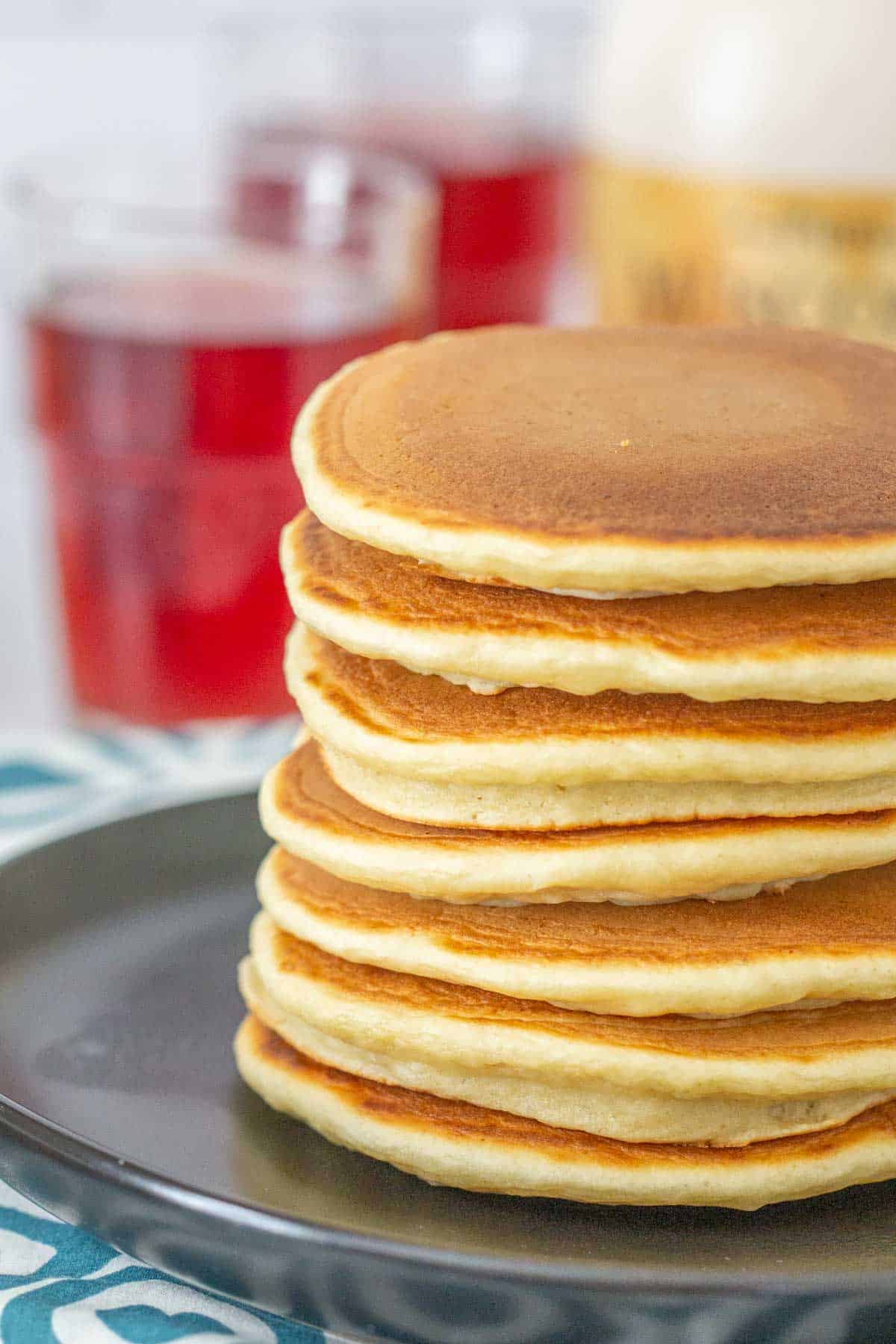 stack of applesauce pancakes on black plate