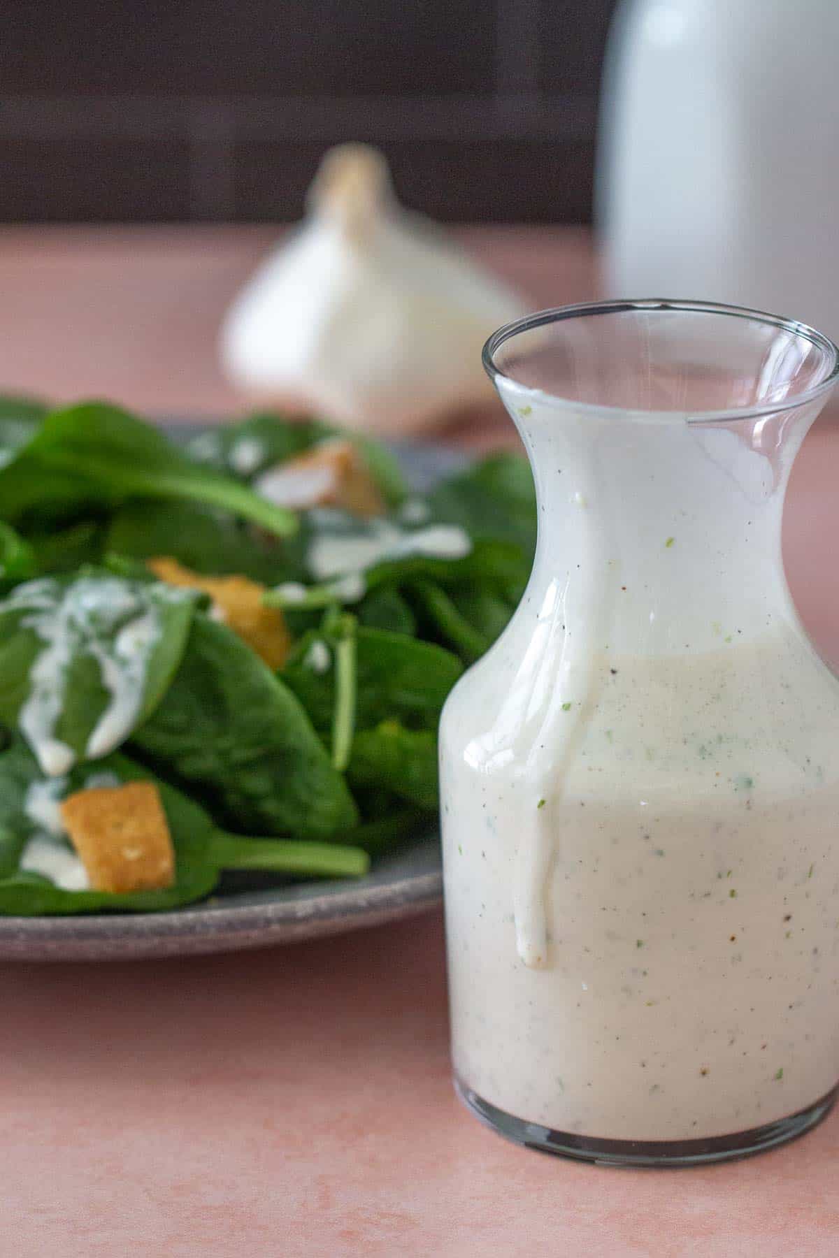 carafe of creamy garlic dressing