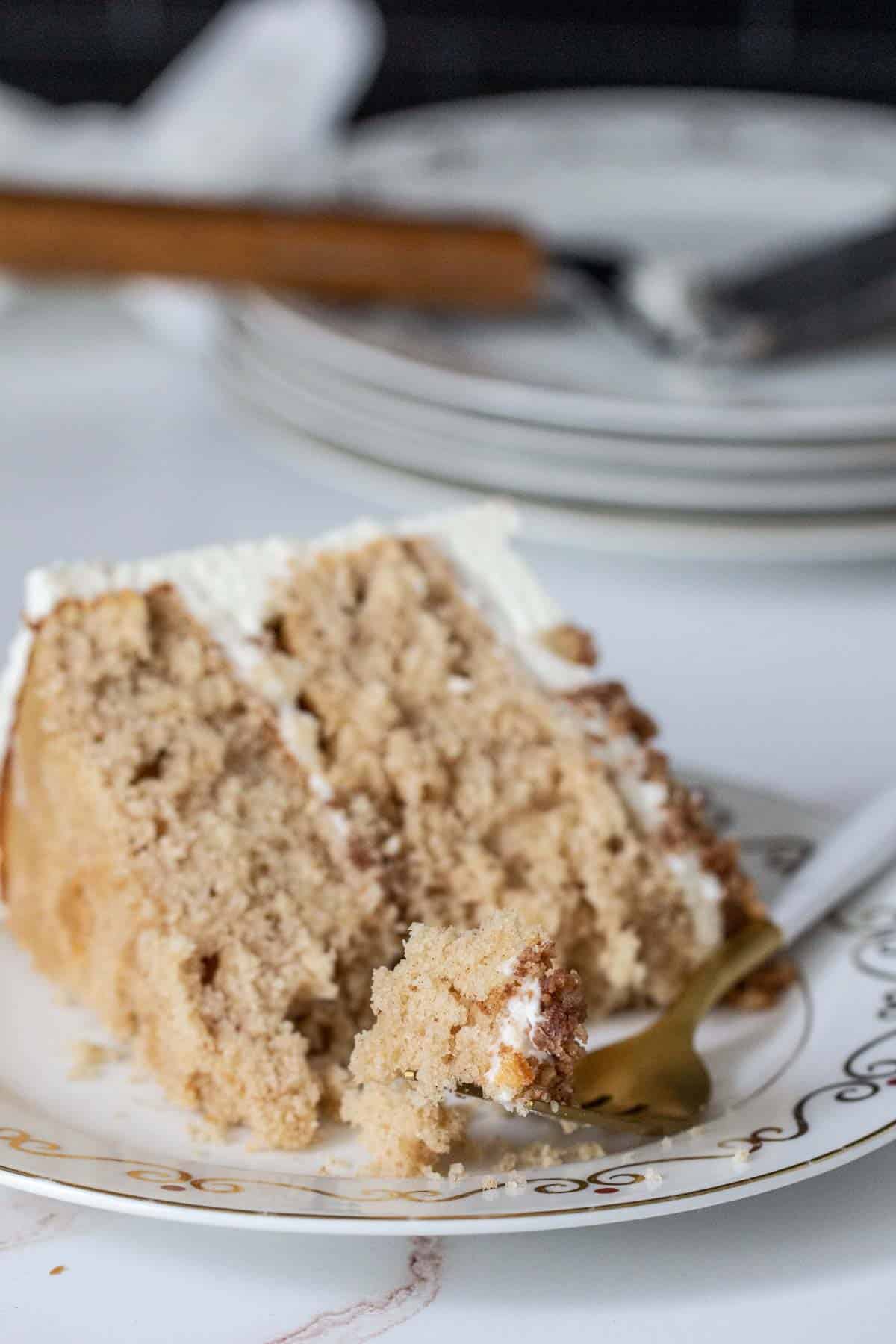 slice of snickerdoodle cake with fork taking a piece