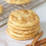stack of snickerdoodle cookies with cinnamon sticks