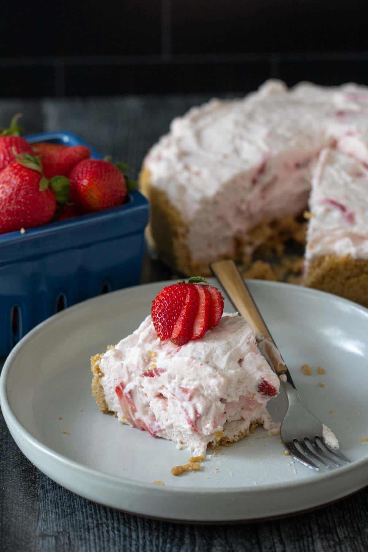 slice of strawberry chiffon pie with part eaten