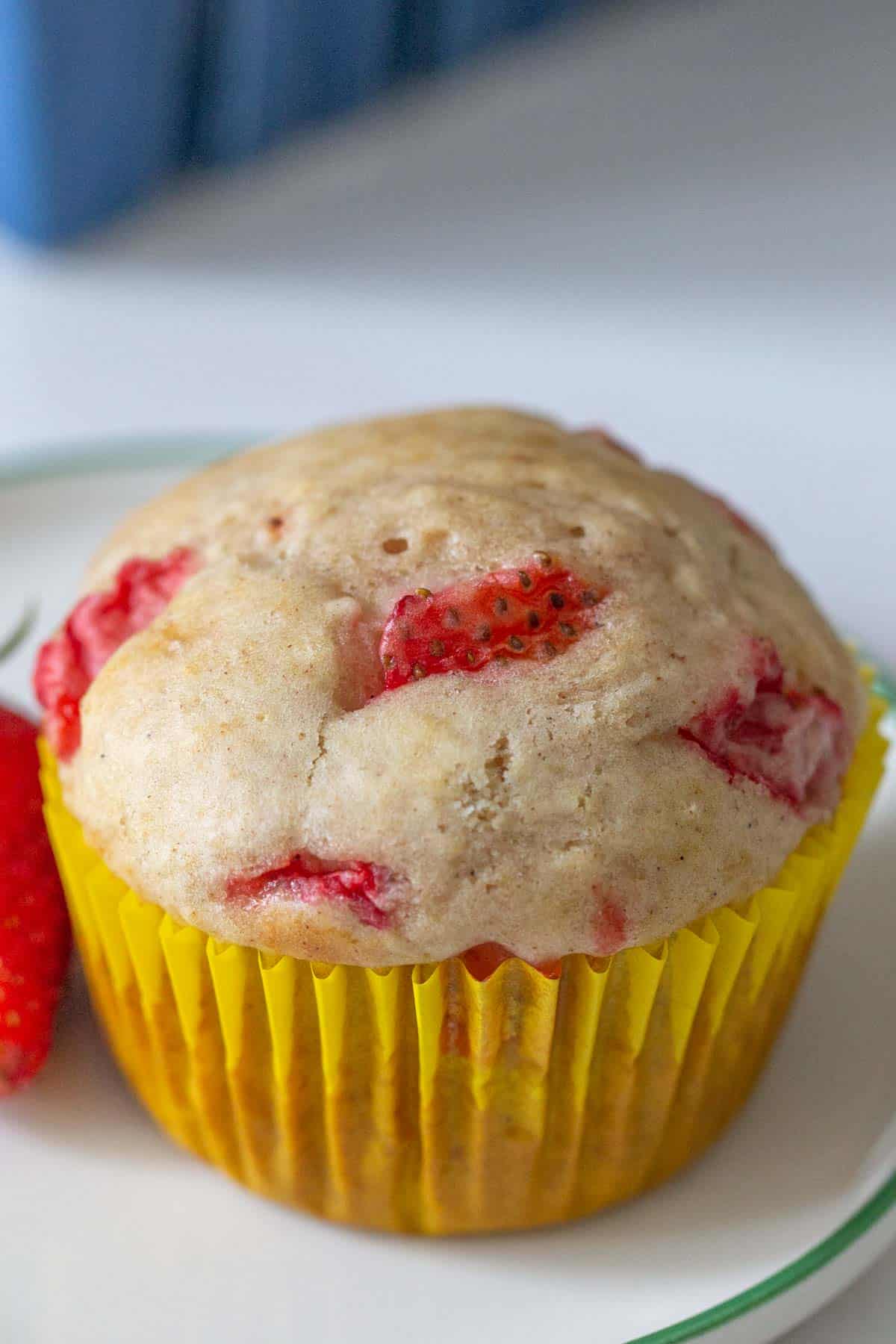 close up strawberry muffin in yellow paper