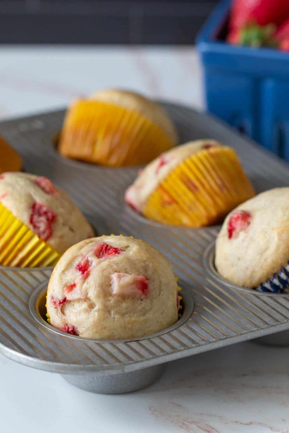 strawberry muffins in muffin tin