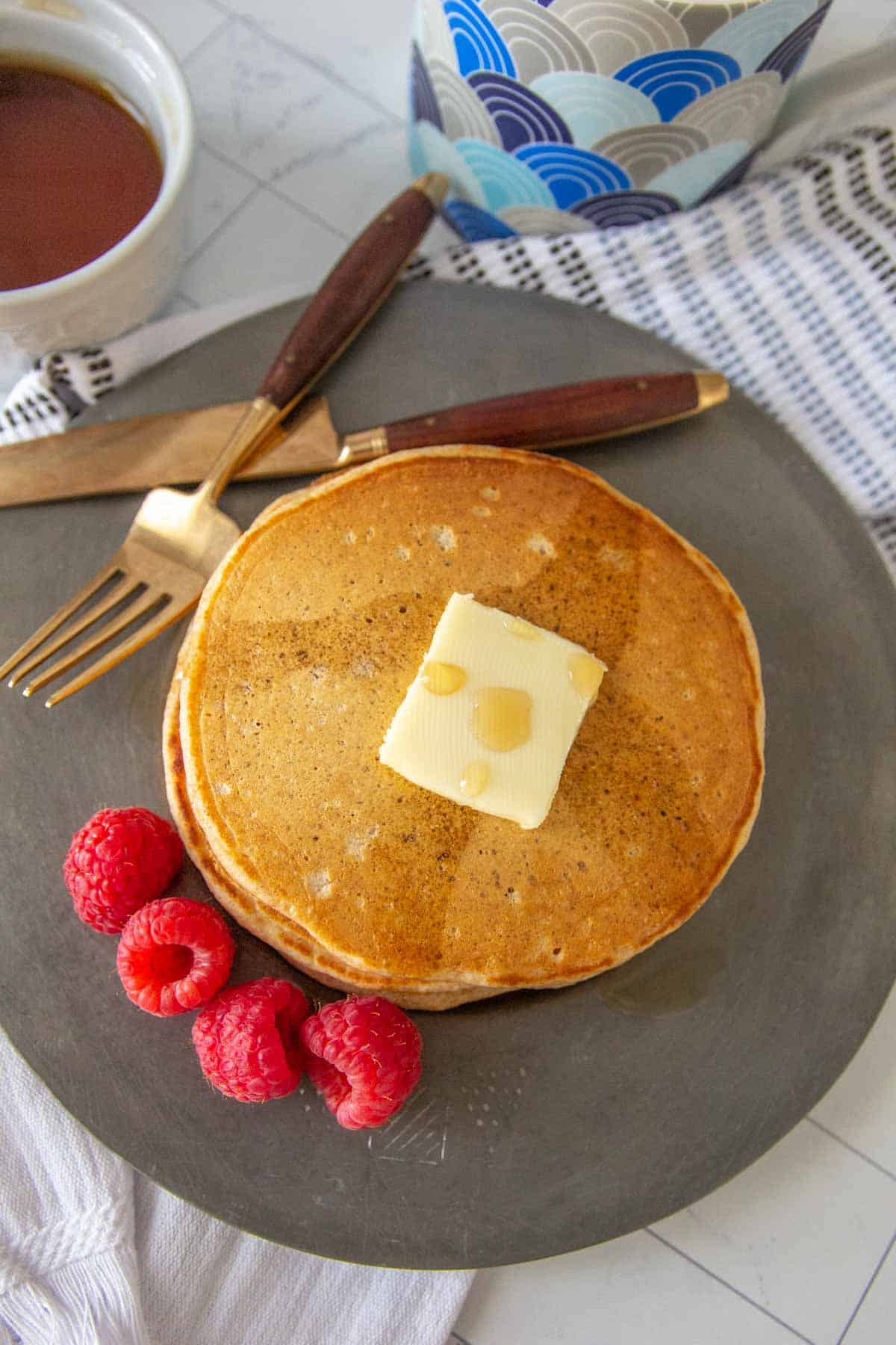 overhead whole wheat pancakes on a plate with berries