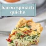 A slice of bacon spinach quiche on a plate with a fork, whole eggs in a bowl in the background, and text reading "bacon spinach quiche," showcasing this savory breakfast favorite.