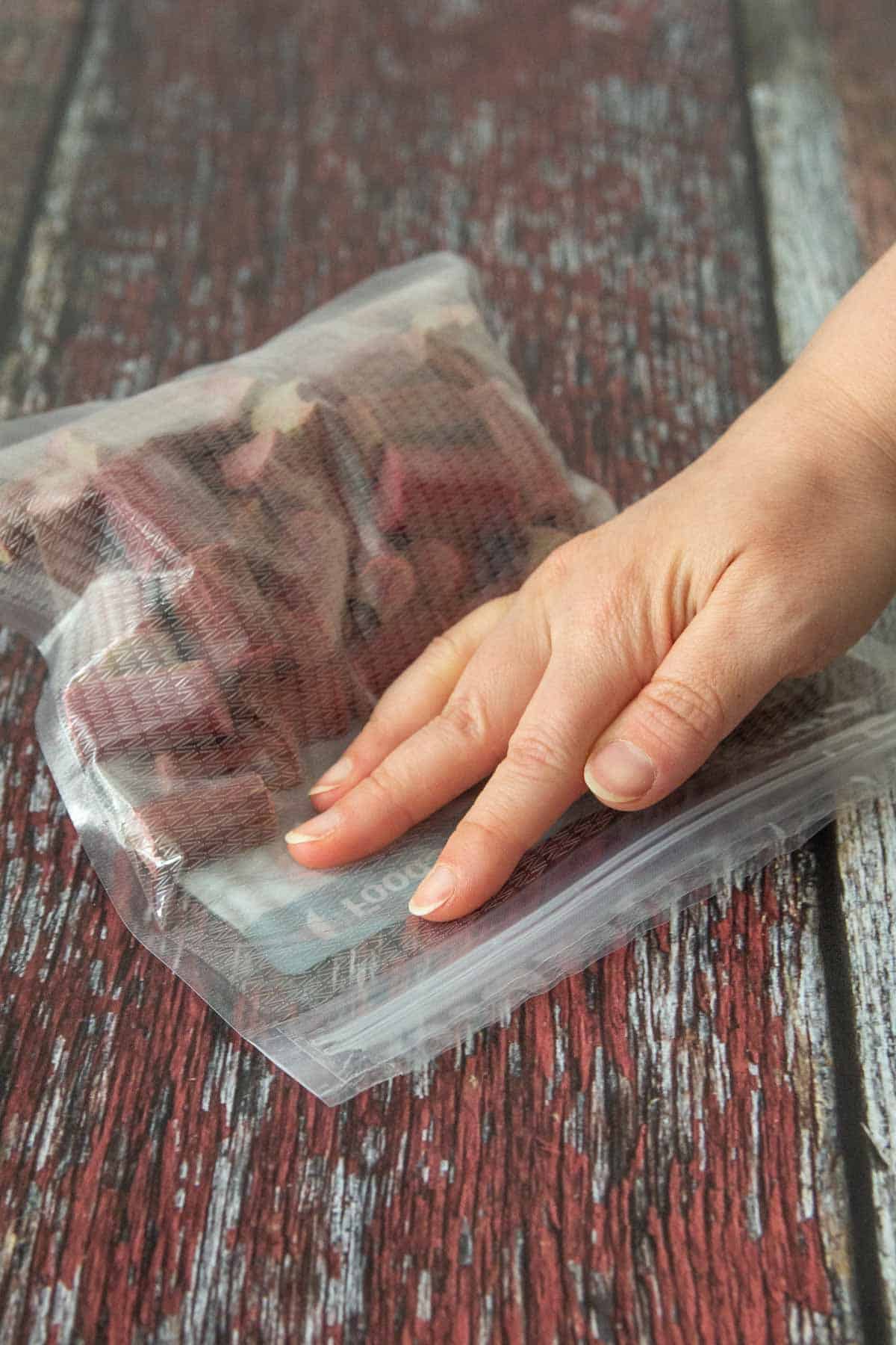 sealing freezer bag of rhubarb