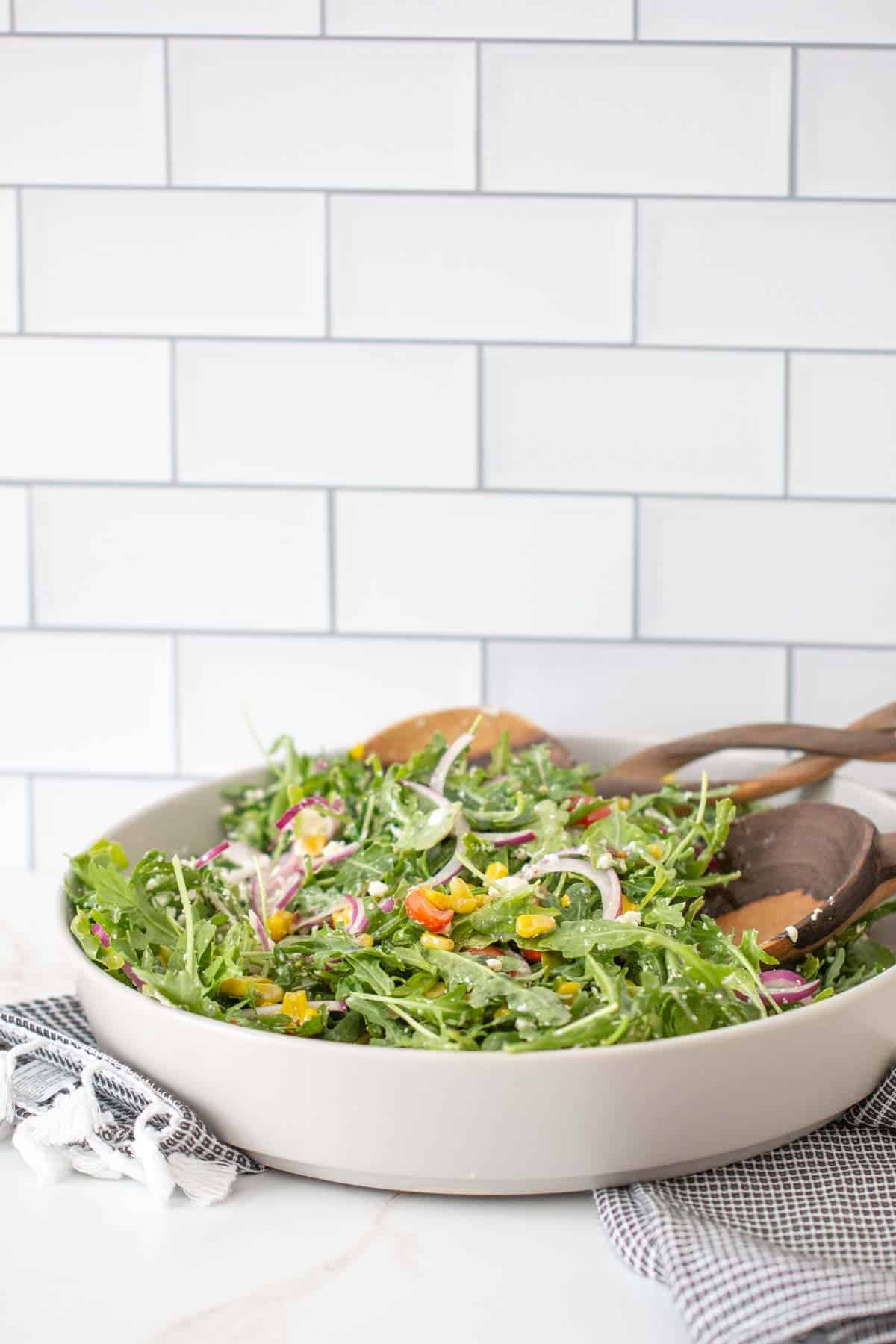 tossed roasted corn salad in a bowl