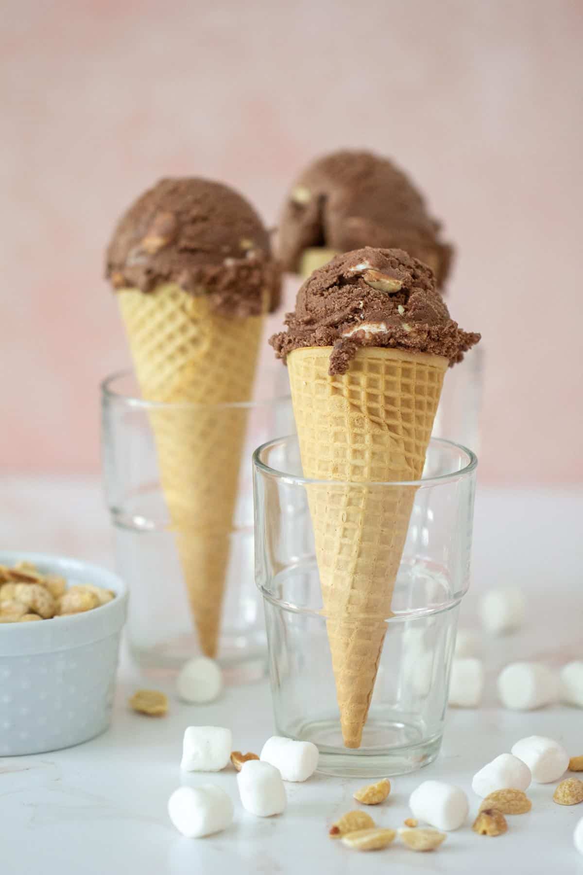 rocky road ice cream in cones set in glass cups