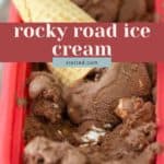 A container of creamy rocky road ice cream with visible chocolate chunks, nuts, and marshmallows, topped with two wafer cookies. Text overlay reads "rocky road ice cream stetted.com".