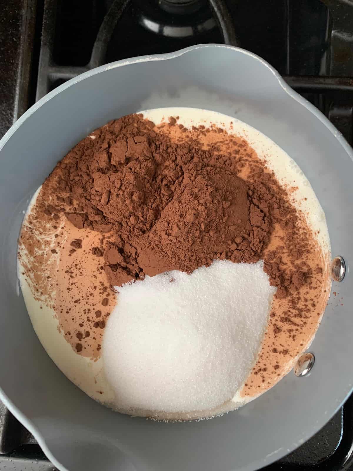 cream, sugar, and cocoa in saucepan