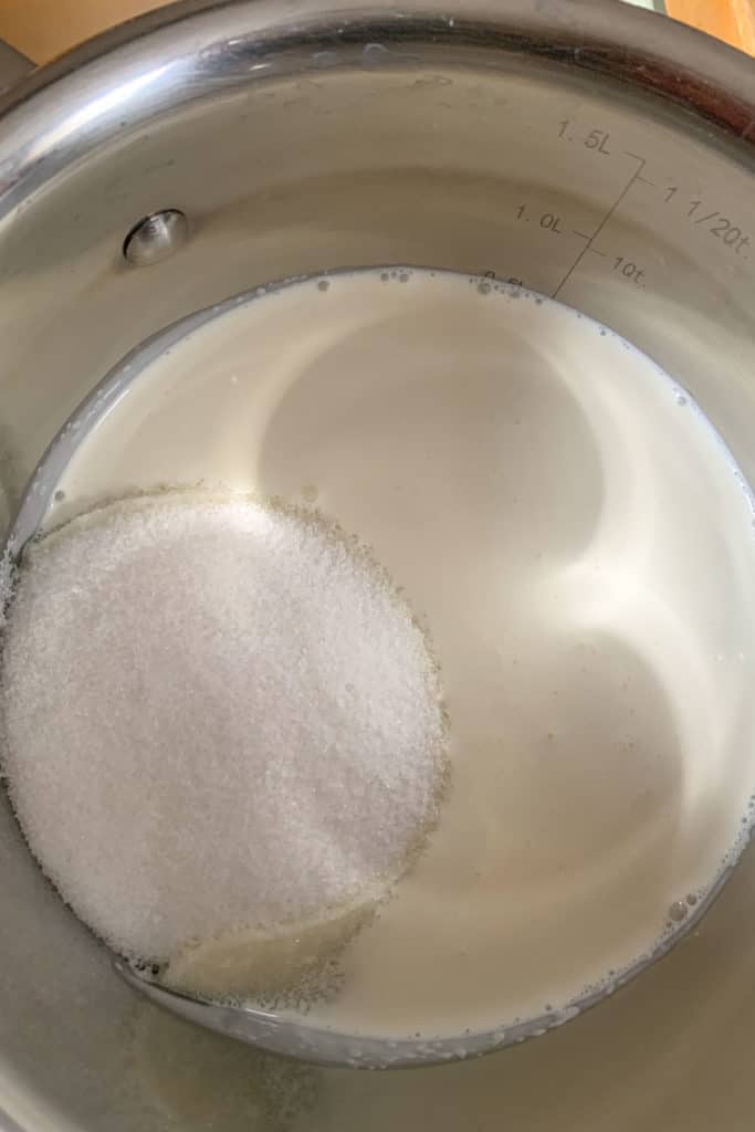 combining sugar and cream in saucepan