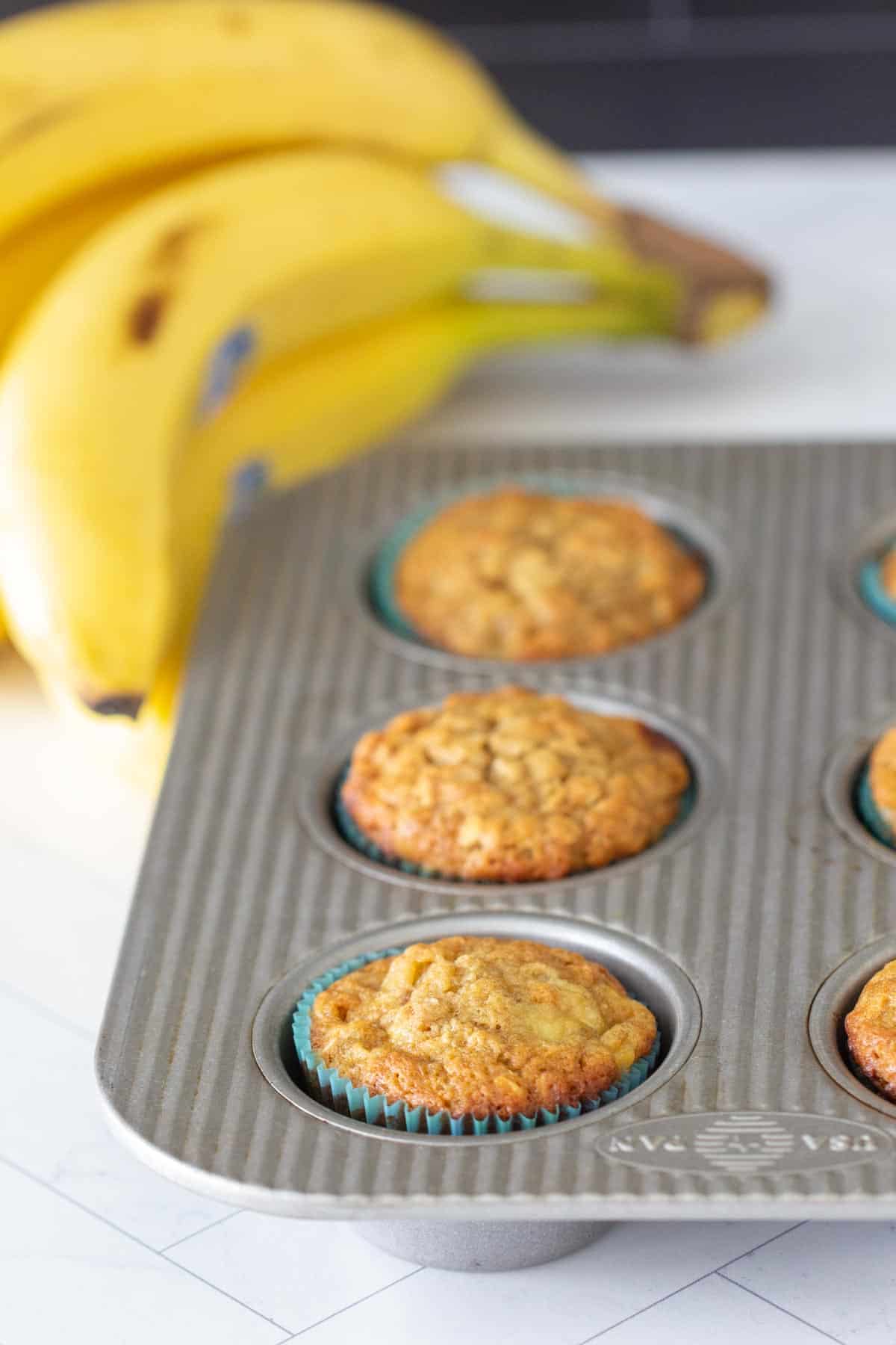 banana oat muffins in baking pan