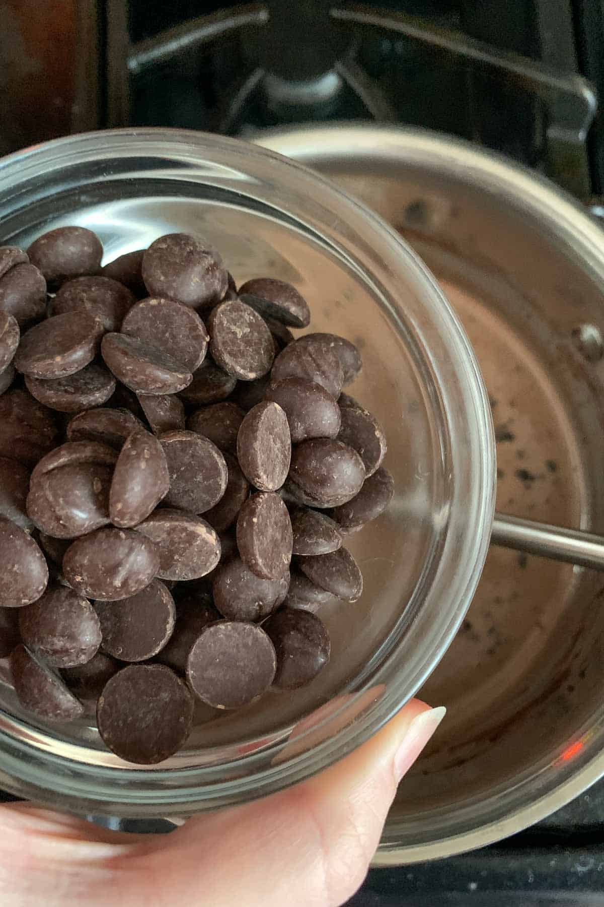 adding chocolate to cream