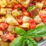 close up of panzanella salad with basil leaves