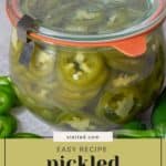 A glass jar filled with sliced pickled jalapeños, sealed with a metal clasp lid, sits on a countertop with fresh jalapeños beside it. Text reads: "Easy pickled jalapeños recipe.