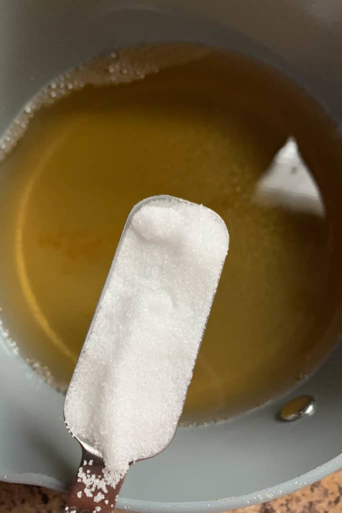 adding salt to brine