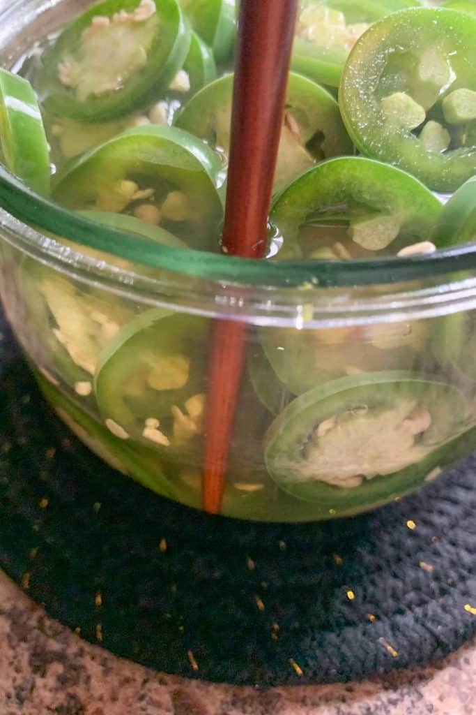 removing air bubbles from jar with chopstick