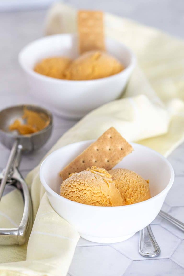 pumpkin ice cream in bowls with graham crackers as garnish