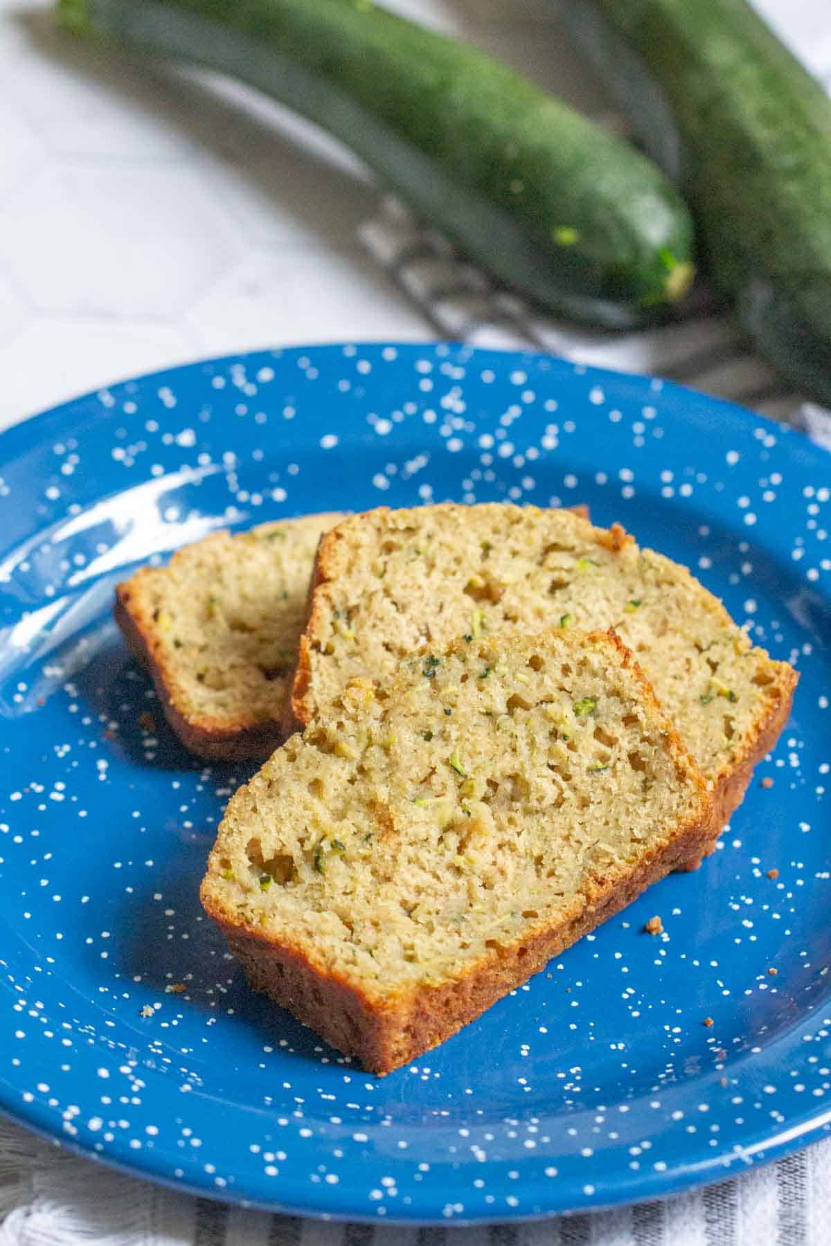 slices of zucchini bread on blue plate