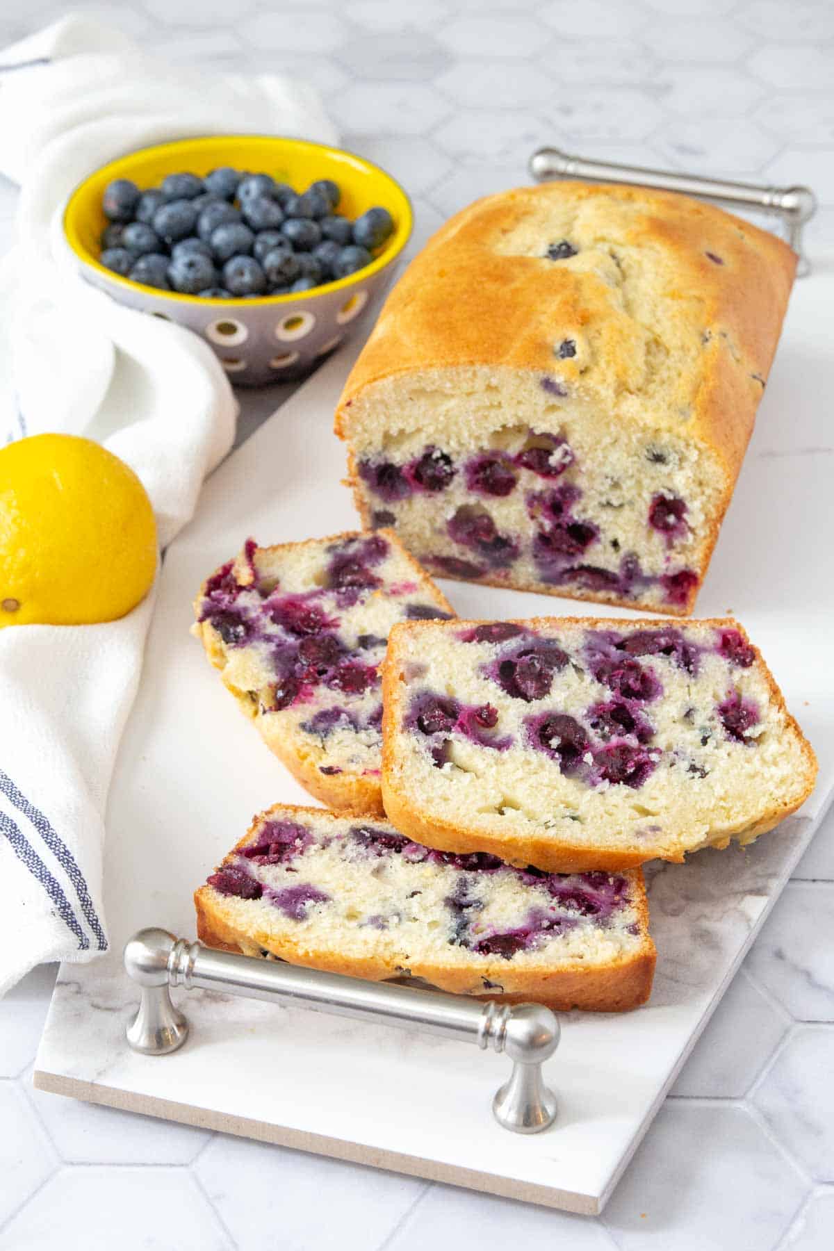 blueberry bread sliced on serving tray
