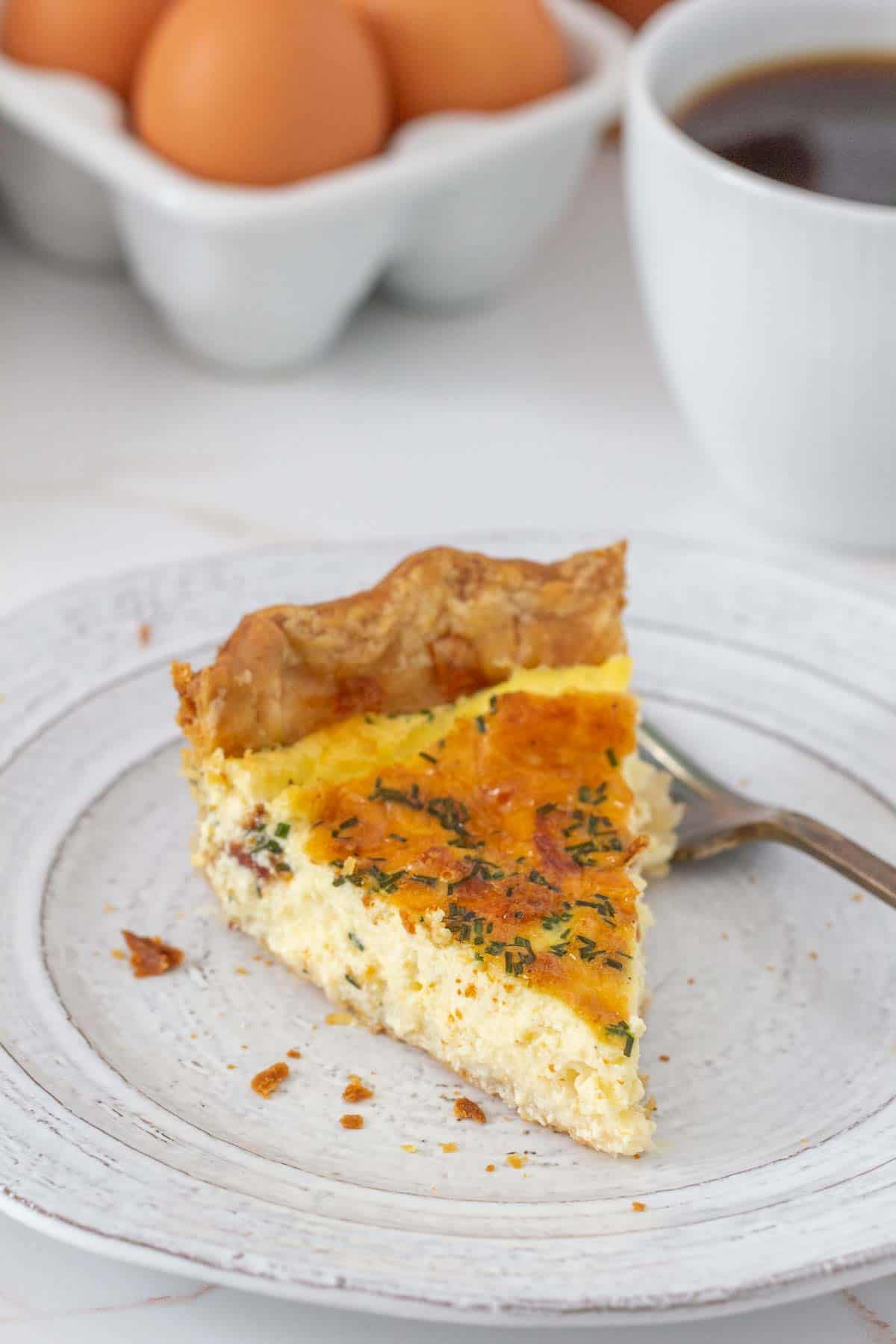 slice of cheese quiche on gray plate