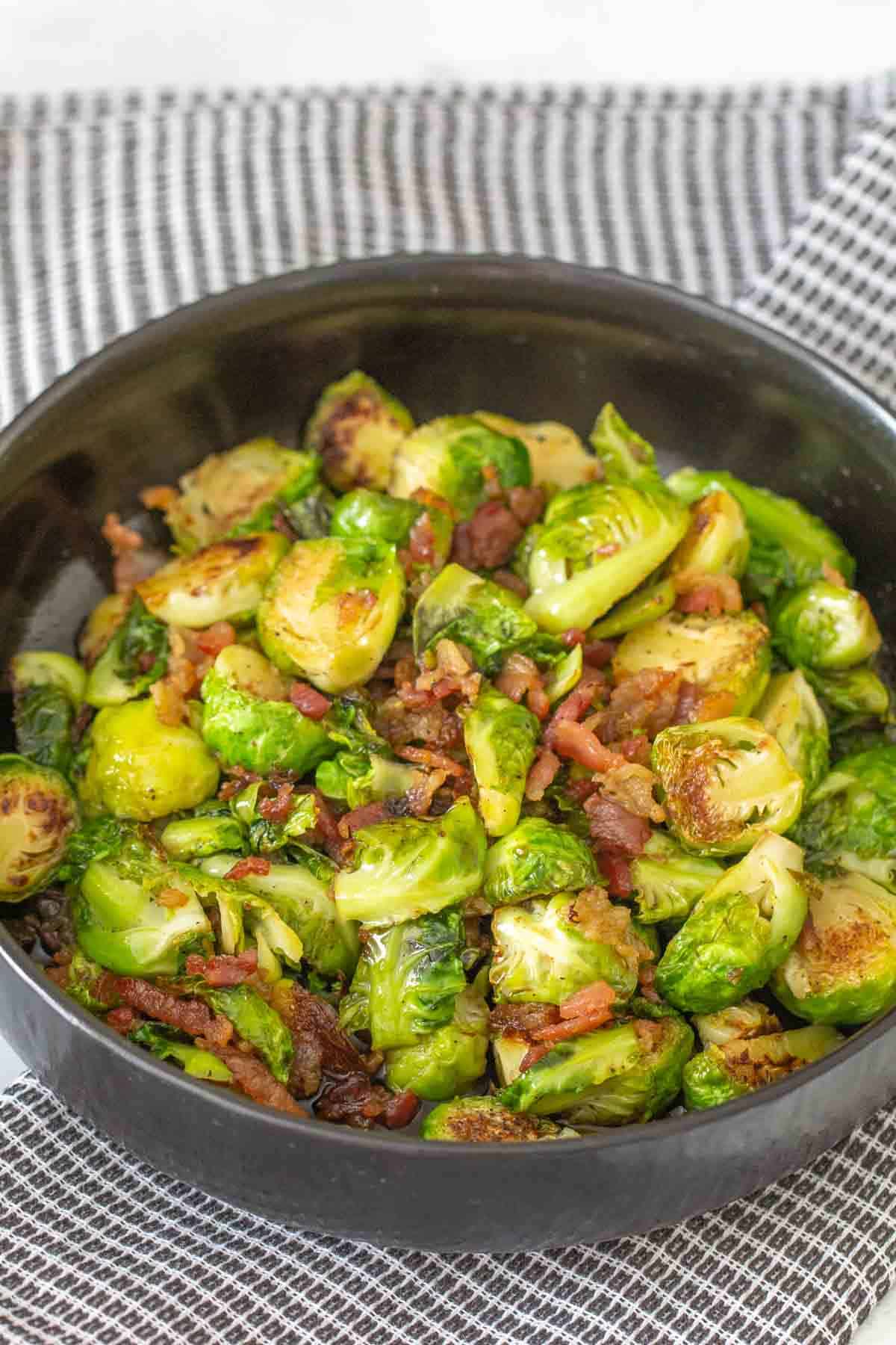 black serving bowl with maple bacon brussels sprouts