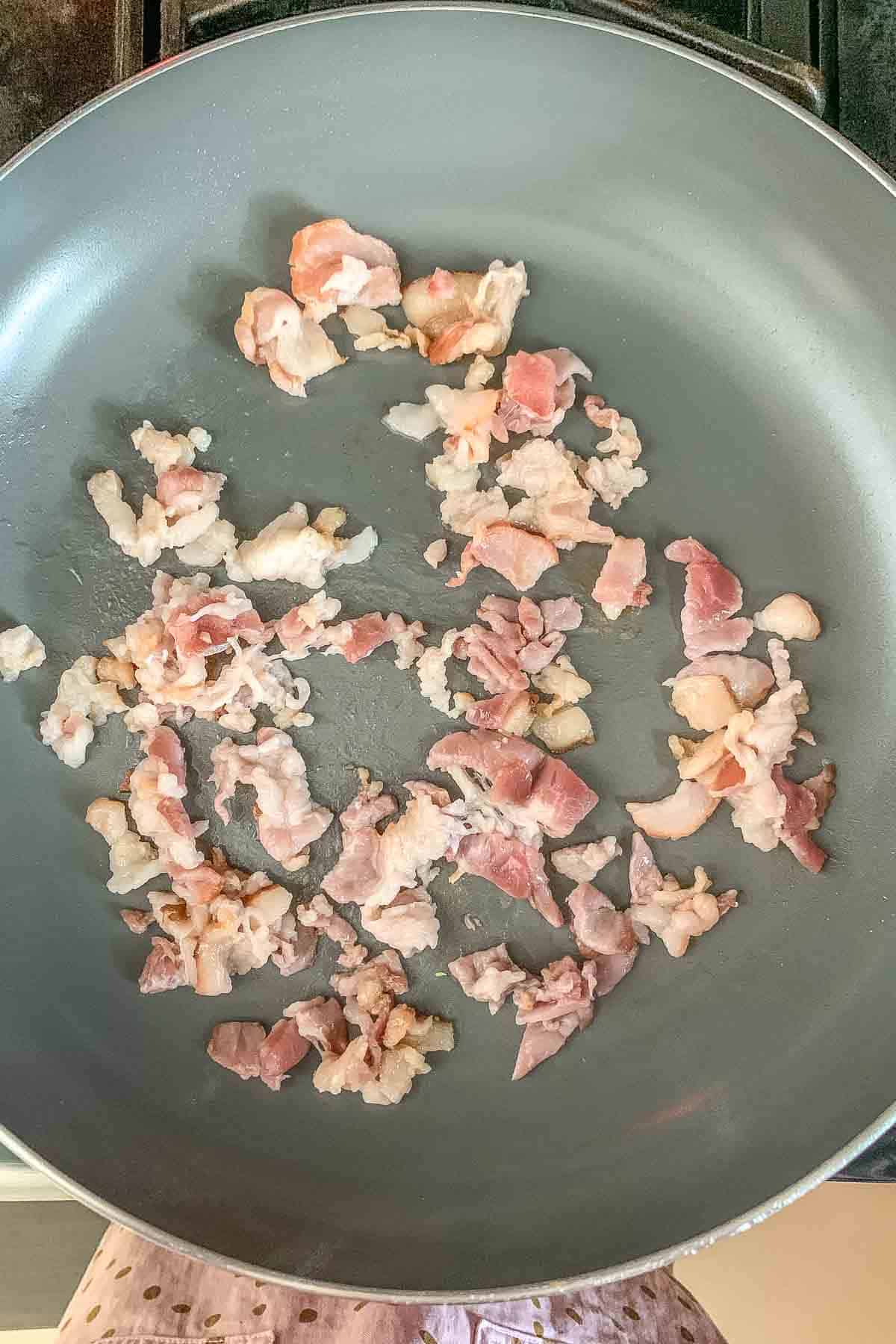cooking bacon pieces in saute pan
