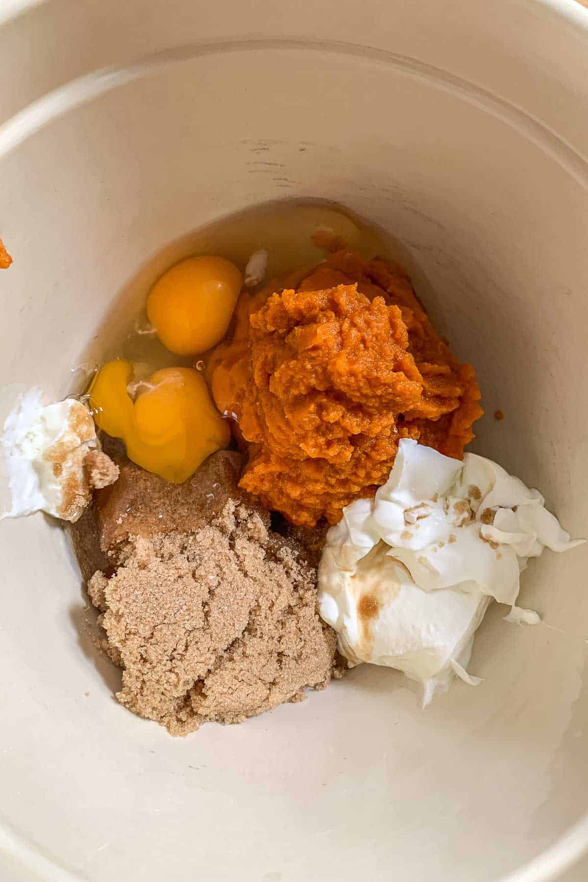 pumpkin, brown sugar, eggs, sour cream, and vanilla in mixing bowl