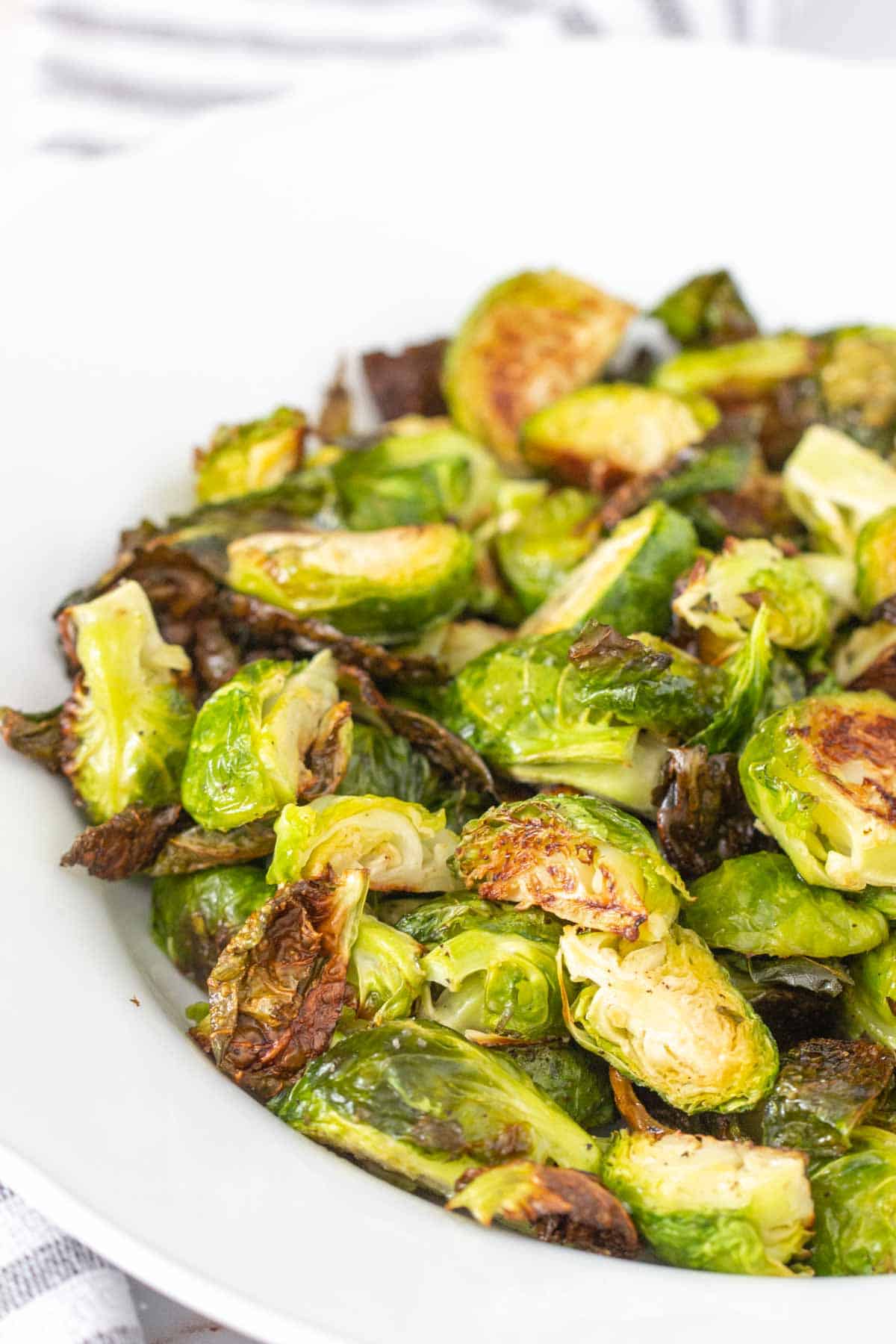 close up bowl of roasted brussels sprouts