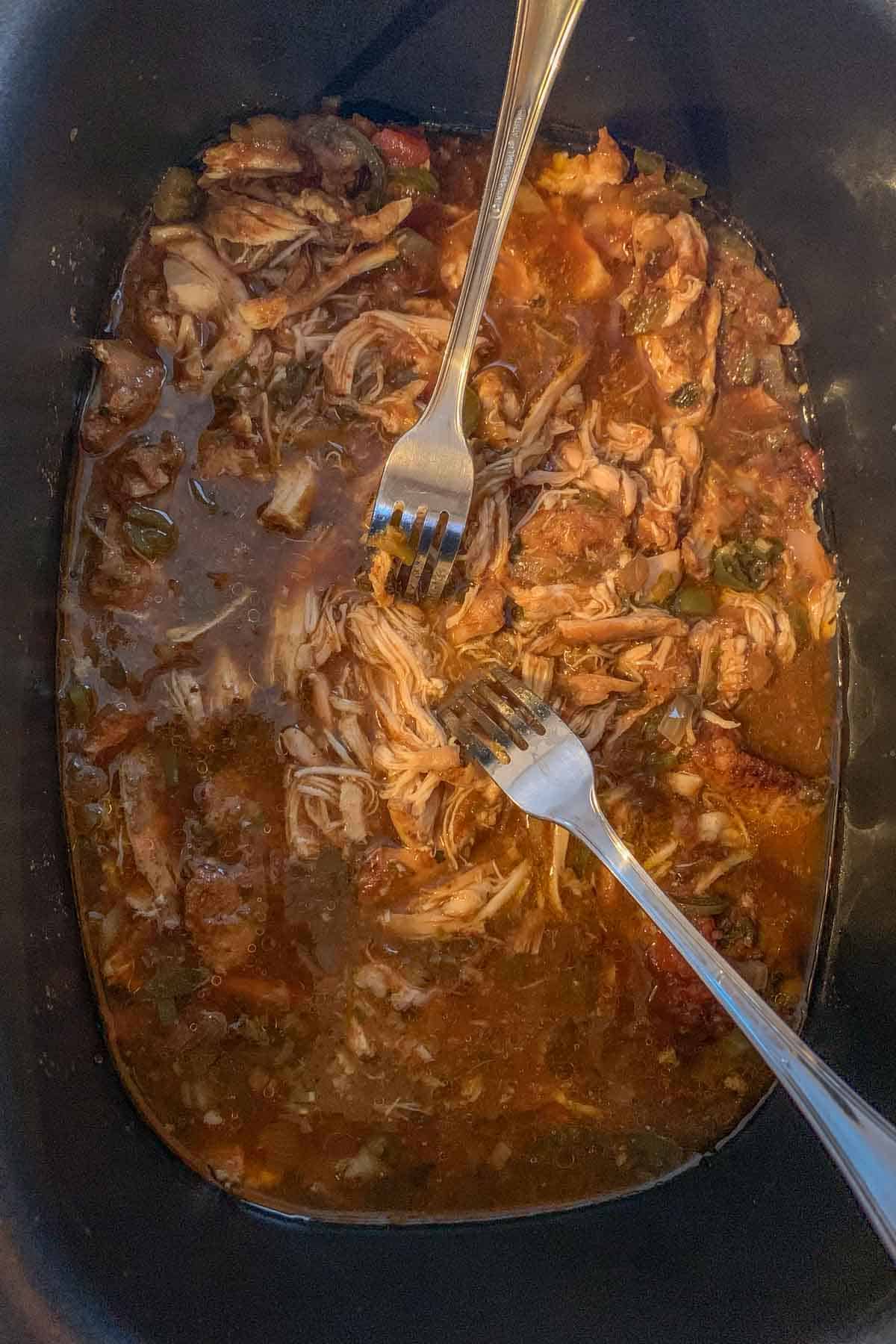 shredding chicken tacos in crock pot