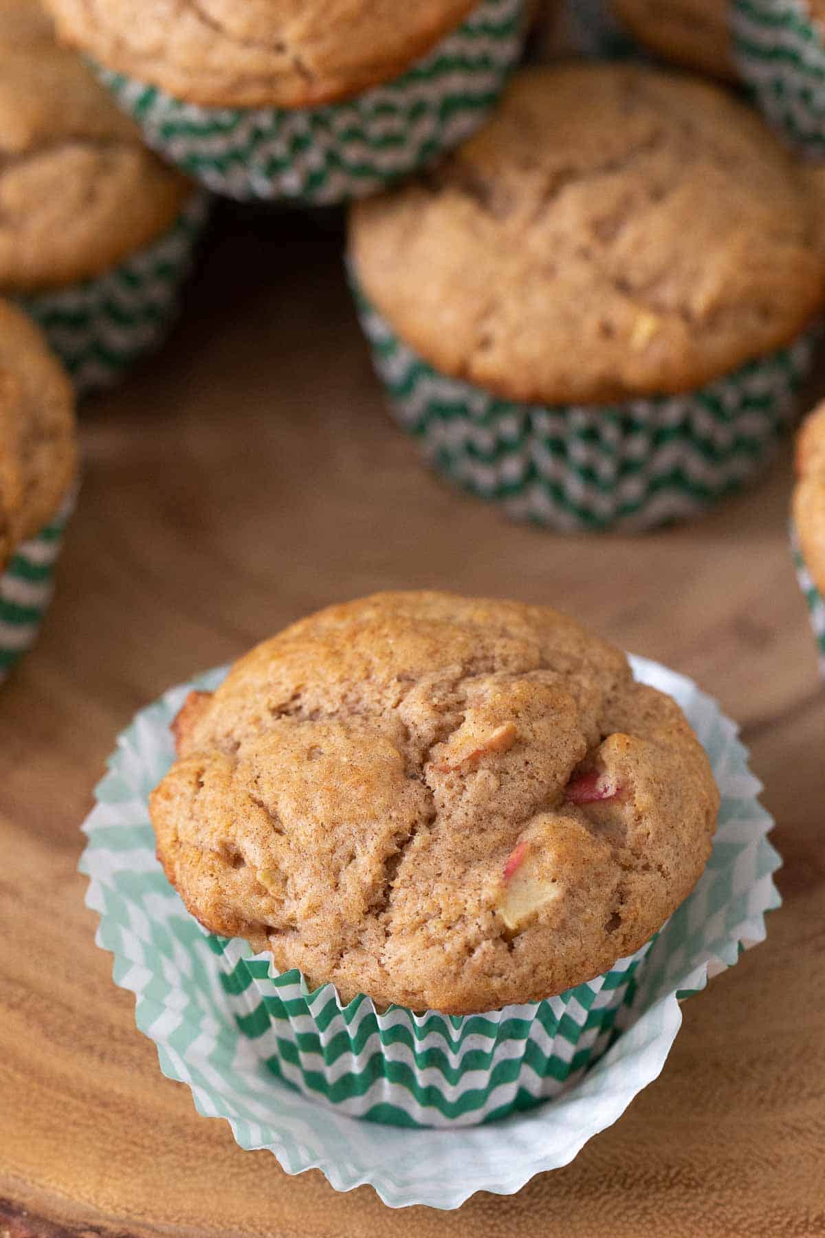 apple cinnamon muffin in green striped paper liner