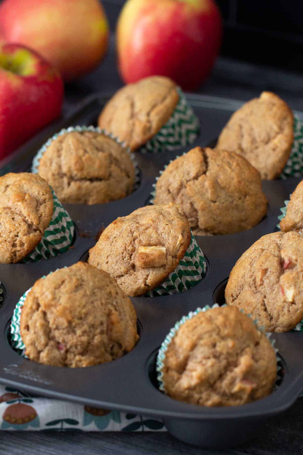 apple cinnamon muffins in muffin tin