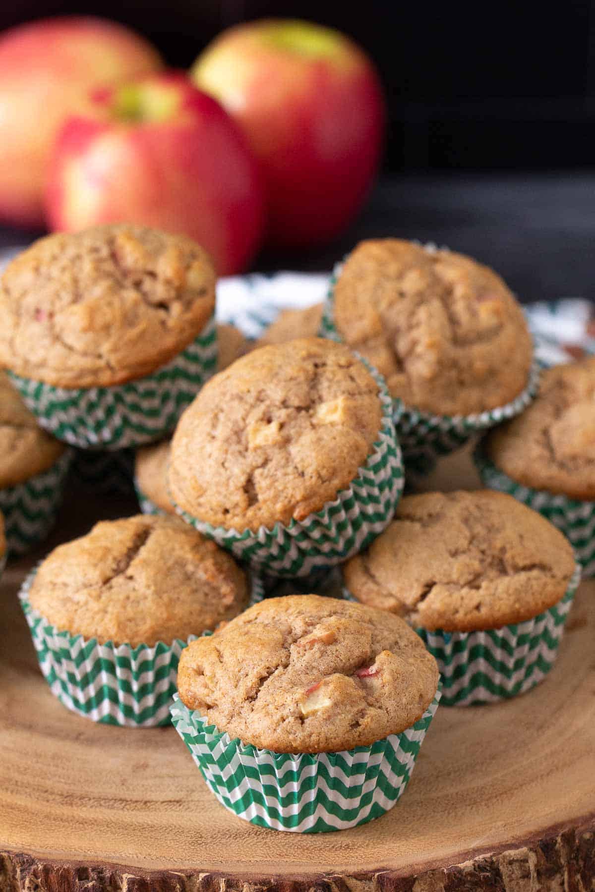 apple cinnamon muffins on wood tray