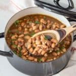 borracho beans in pot with spoon