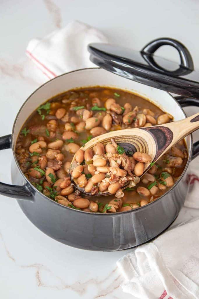 borracho beans in pot with spoon