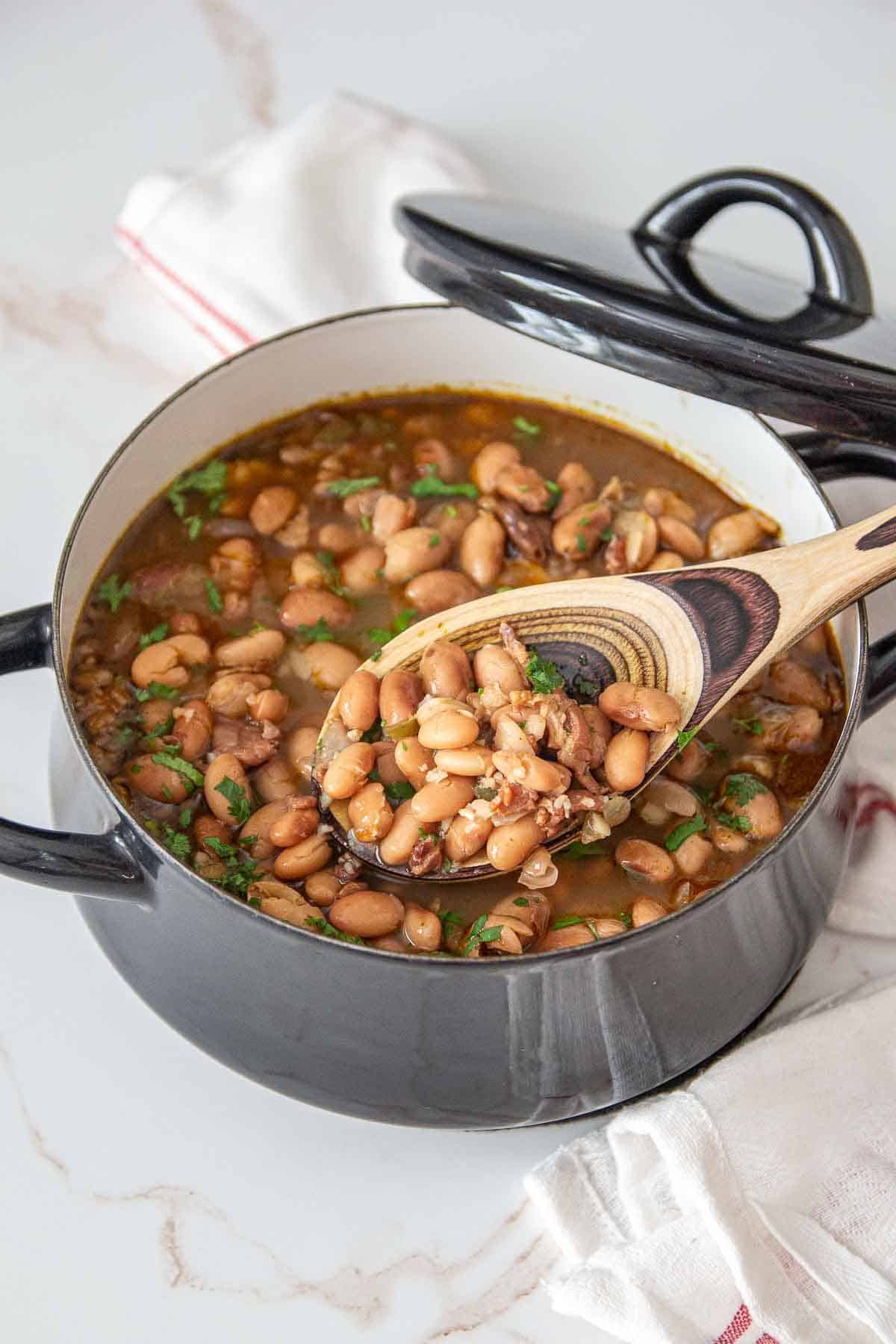 borracho beans in pot with spoon