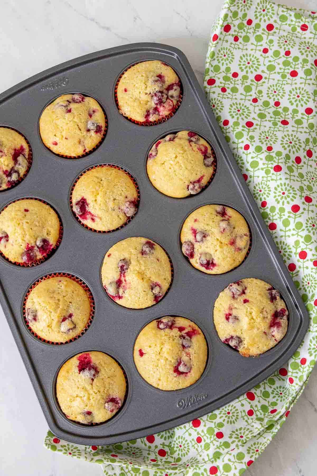 baked cranberry orange muffins in pan