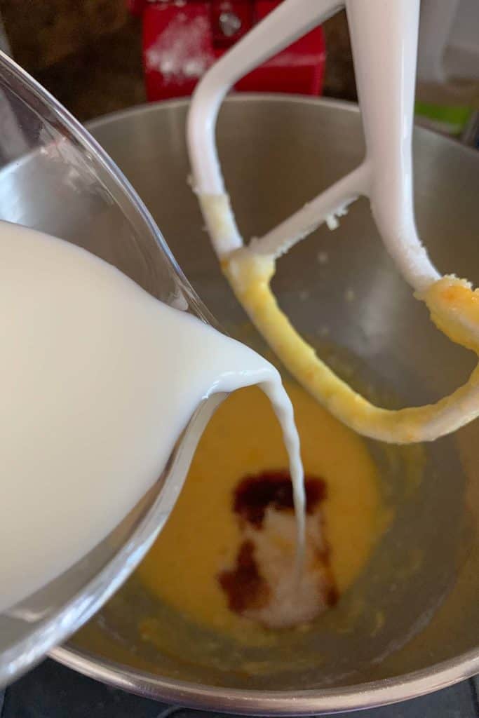 adding milk to muffin batter